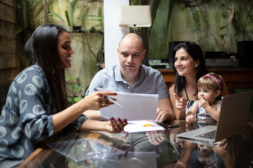 A caseworker talking with a family.